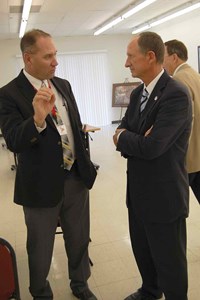 First-year Mayfield Independent Schools Superintendent Joe Henderson (left) makes a point in this one-on-one chat with Rep. Richard Heath (R-Mayfield). Echoing statements by his colleagues, Heath noted there will be considerable competition for any new funding when the legislature crafts the state budget for the 2016-18 biennium.