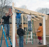 Members of the ATC carpentry class – (from left) Avory Lowe, Deklan Osborne, teacher Mike Jude, Cody Bowen and Kyle Bowen – employ geometrical calculations, estimations of stress and weather hardiness of materials in building the two gazebos. They even learn about logistics – one of the gazebos is being built in sections as it runs 24 feet wide but must travel over a 20-foot bridge to get to its eventual home.