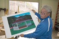 Carpentry teacher Mike Jude displays an artist’s rendering of the design for the final product. Jude obtained a $25,000 Skills USA Community Services grant plus assistance from the area Lowes Home Improvement store to support the project.