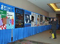 Southgate Independent Superintendent Jim Palm takes advantage of a rare open hallway to get a shot of his district’s banner.