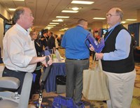 Jessamine County board member Gene Peel, right, talks with Tom Underwood with the Kentucky Propane Education and Research Council at the group’s Trade Show booth.