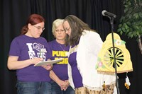 Members of the Bowling Green Independent-sponsored The Purple Powers that Bee team strain their brains before offering their response to the polysyllabic word quiz. In this year’s event, 11 teams of three did most of the spelling, but in a trivia round, audience members were called on to take their best shot.