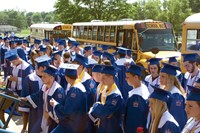 The district bused the nearly 200 graduating seniors from the high school to the primary and middle schools for their walks through corridors, lobbies and a gymnasium with the stands packed with cheering students. More than a few of the adults involved, including Superintendent Alan Reed, admitted to feeling emotions ranging from pride to sadness as seniors were greeted with teary-eyed hugs from former teachers.