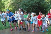 Anchorage students, siblings and supporters braved several brief showers to kick the evening’s festivities off with 2-mile, 1-mile, and half-mile runs followed by a saunter-until-you-get-tired walk for several future athletes.