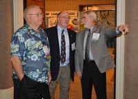 New KSBA President David Webster, right, talks with outgoing President Allen Kennedy, center, and President-Elect Ronnie Holmes during the conference.