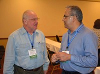 New school board members Timothy Nolan (Campbell County) and Rajiv Johar (Muhlenberg County) talk after a clinic session.
