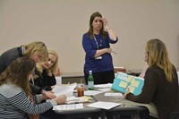 In a “peer review” session led by Tumolo-Wash, Rachael Rawlings, another Oldham County Schools’ speech language pathologist, raises a point with members of her training team. Peer reviews require school personnel with similar roles to examine documents to ensure correct coding of speech, occupational, physical, mental health and nursing services to students.