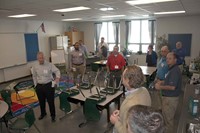 Pat Blackburn with VBN Architects talks to energy managers and others on the tour about the classrooms, where occupancy sensors are used to automatically control classroom lighting, ventilation and space conditioning. When there is no activity in the room for 15 minutes, lights will automatically turn off, ventilation air is reduced to a minimum airflow and the heat pump cycles to a standby mode.