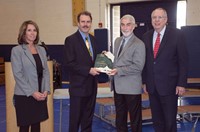 KSBA President David Webster, second from right, and KSBA Executive Director Mike Armstrong, far right, present the 2017 Spring PEAK Award to Erlanger-Elsmere School Board Chairman Tom Luken and Superintendent Dr. Kathy Burkhardt. 