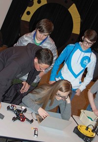 Elizabeth Gilbert, a junior at Wolfe County High School, synchronizes software built into the drone at her right with corresponding command technology to direct the unit’s flight. KVEC is building a modular classroom next to its Hazard headquarters initially for use by students interested in drone technology with an eventual plan to relocate the facility to the site of the proposed drone port as a training center for scientists and students.