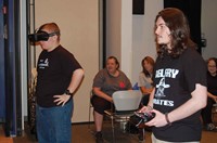 While Belfry High School (Pike County) sophomore Seth Hatfield guides his team’s drone through the obstacle course, teammate Austin Stafford follows the flight path using goggles linked to a live miniature camera mounted on the drone. After several trips over the course, Stafford observed, “That’s a lot harder than it seems, man.”