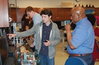 Local engineer Eric  Crawford of Akebono Brake Corp. (right) watches as principles in engineering st