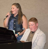 At the First Region meeting, Hickman County High School students Hannah Carroll and Ryker Cagle sing