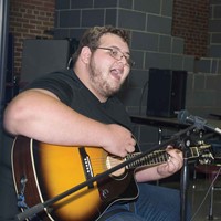 At the Upper Kentucky River meeting in early September, Lee County student Todd Fultz plays a guitar