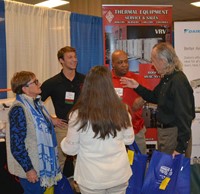 Representatives of Thermal Equipment Sales talk to Woodford County board members Karen Brock, Sherri