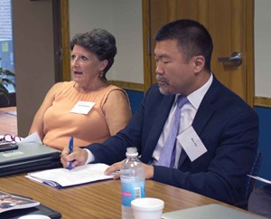 Frankfort Independent school board member Jina Greathouse  participates in the discussion at the KSBA Equity Cadre’s first meeting as Stephen Chi listens.