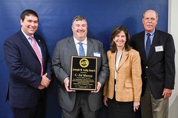 Kentucky Board of Education Chairwoman Mary Gwen Wheeler, accompanied by Commissioner Stephen Pruitt (far left), presents the Joseph W. Kelly Award to C. Ed Massey. Joe Kelly is pictured far right.  (Photo by Bobby Ellis, Kentucky Department of Education)
