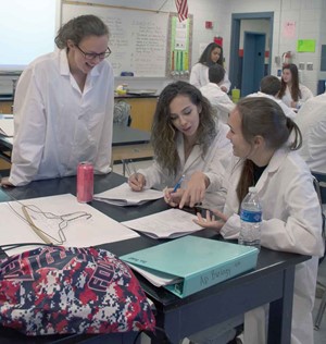 L-R, Jade Bloemer, who led the class in an opening activity, checks to see whether Madison Holbrook and Dani Bryant have any questions.