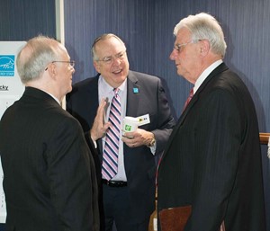 Ron Willhite (left), director of the School Energy Managers Project, and Mike Armstrong (center), executive director of the Kentucky School Boards Association, talk to Kentucky Public Service Commission Chairman Michael Schmitt prior to the opening sessio