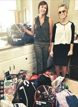Volunteers (and sisters) Dana Taylor Garrett and Deana Wheeler deliver Kids in Transition backpacks and bags to the Lincoln Trail Elementary Family Resource Center. (Photo courtesy of Hardin County Schools)