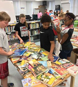 Southgate Independent students look at books during the district's "Big Bag of Books" event. (Photo courtesy of Southgate Independent Schools)