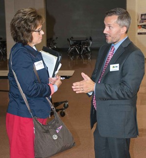 KSBA Governmental Relations Director Eric Kennedy (right) talks to State Rep. Melinda Gibbons Prunty at the Fall Regional Meeting in Webster County.