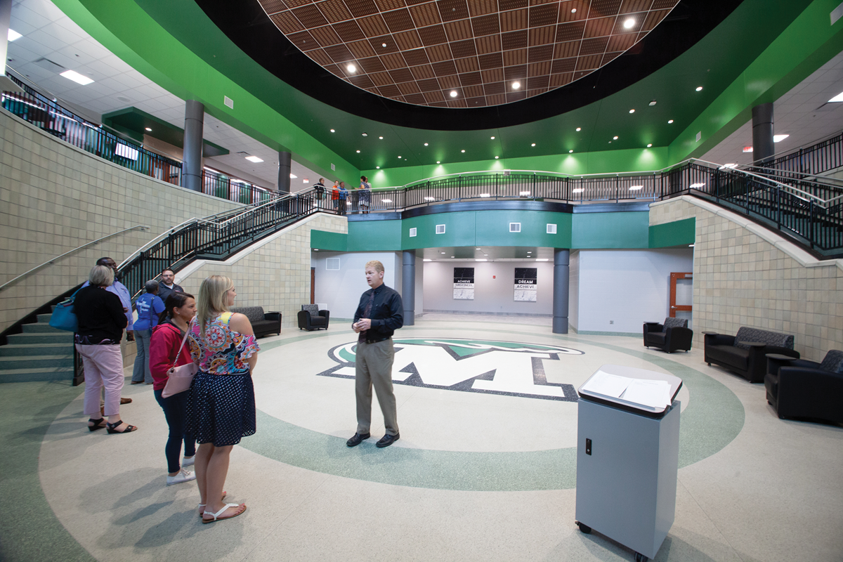 Bill Adams, associate superintendent for Meade County, leads a group on a tour of the district's College and Career Center. (Photos courtesy of Meade County Schools and Morningtide Media)