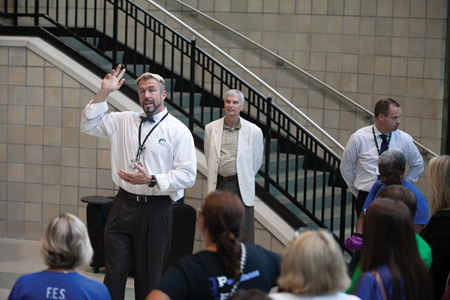 Meade County Schools Superintendent John Millay talks to a group of teachers about the district’s College and Career Center during an open house this past summer.