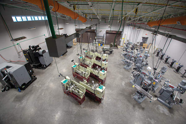 The renovation to the district’s technology center included upgrades to existing manufacturing bays and the addition of 50,000 square feet of new space. Pictured above is the computerized manufacturing and machining area.