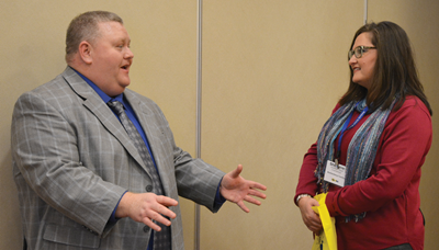 Clabe Slone (left), KEDC’s projects and operations director, talks to Stefanie Rager, Muhlenberg County school board chairwoman, following a clinic session at KSBA’s Winter Symposium.