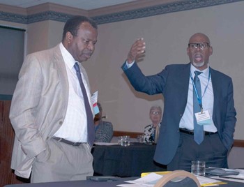Paducah Independent school board members Felix Akojie (left) and James Hudson explain how they worked with a group of middle school students as part of the district’s Gap Closure Project during a session at KSBA’s annual conference.