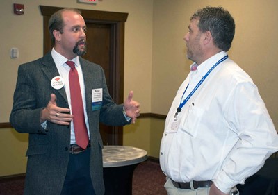 Fleming County Superintendent Brian Creasman, left, talks with Livingston County board member Ron Jones during KSBA's Annual Conference.