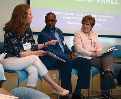 Lauren Mitchell, a school council member from Madison County Schools’ Northside Elementary, makes a point during a discussion at the Parent Leadership Summit. Listening to her right are Fayette County school board members Daryl Love and Melissa Bacon.