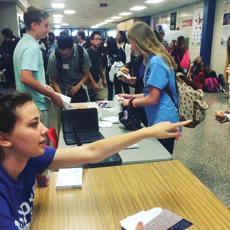 Then-Lafayette High School students Gabriella Epley, foreground, and Eli Dreyer set up a  voter registration table to register eligible students there. Epley graduated in 2017 and Dreyer continued the work before graduating this year. (Photo submitted)