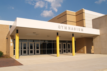 Most school buildings have dozens of doors in addition to the main entrance, including doors to the gymnasium. (Fotolia.com)