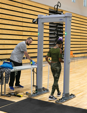 A student passes through a metal detector as she arrives to school at Fayette County Schools’ Frederick Douglass High School. (Photo courtesy of Fayette County Schools)