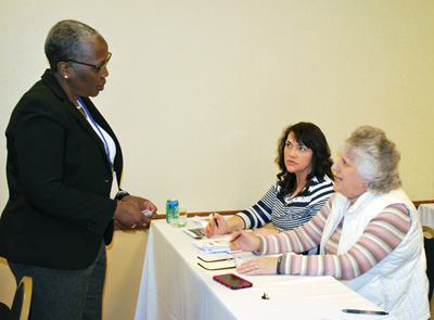 KSBA Equity Cadre member Veda Pendleton (left) discusses equity policies with Morgan County board member Leatha Helwig (center) and Breathitt County board member Anna Morris during KSBA’s Annual Conference. 