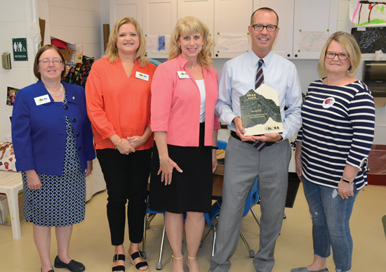 Above: KSBA Executive Director Kerri Schelling (center) presented the Spring 2019 PEAK Award to Dayton Independent Superintendent Jay Brewer and Dayton school board member Diane Huff (far right). Also pictured are Kimber Fender and Jeanne Berger.